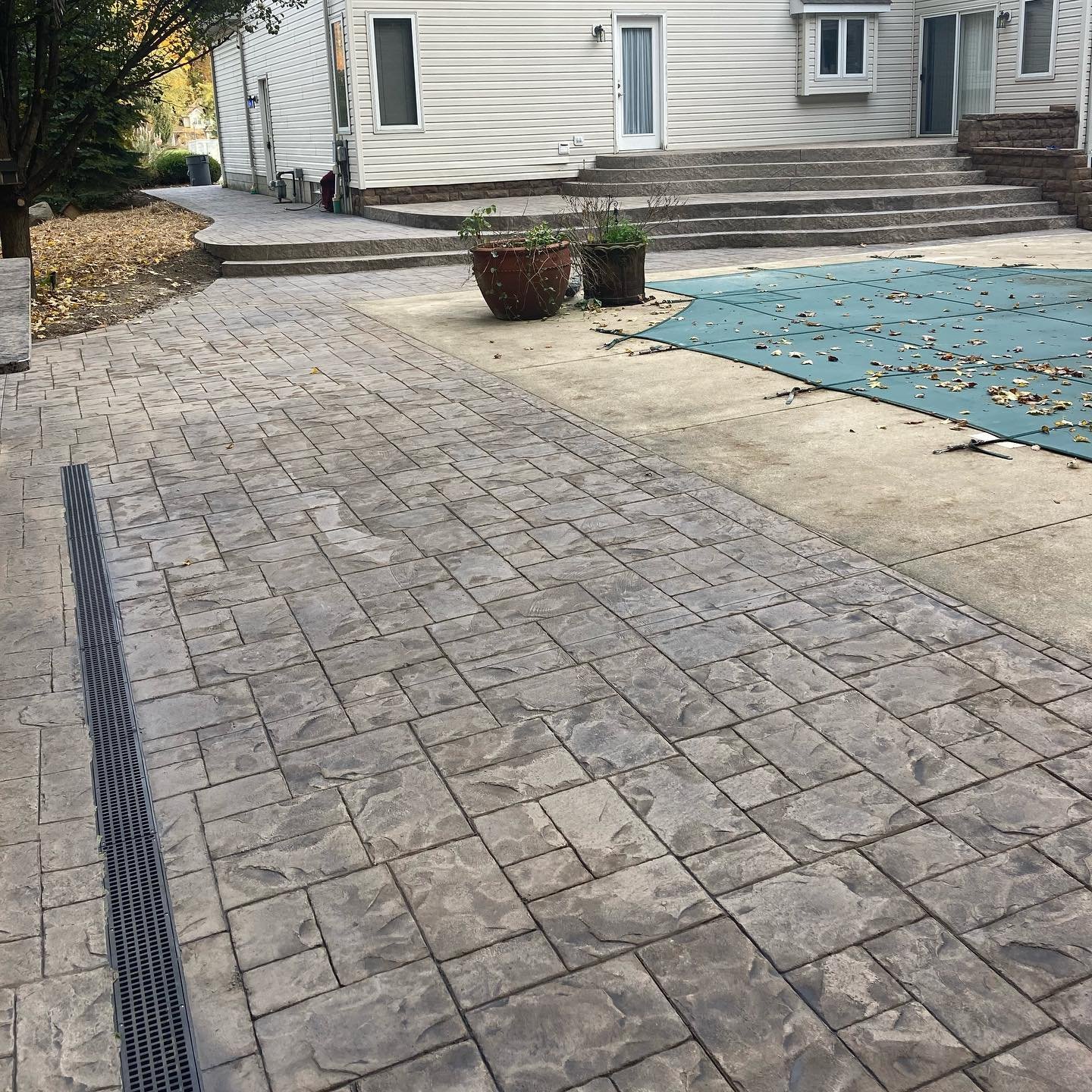 Xpress Construction & Services shows a neat, welcoming patio and porch, with nice landscaping for a cozy family home.