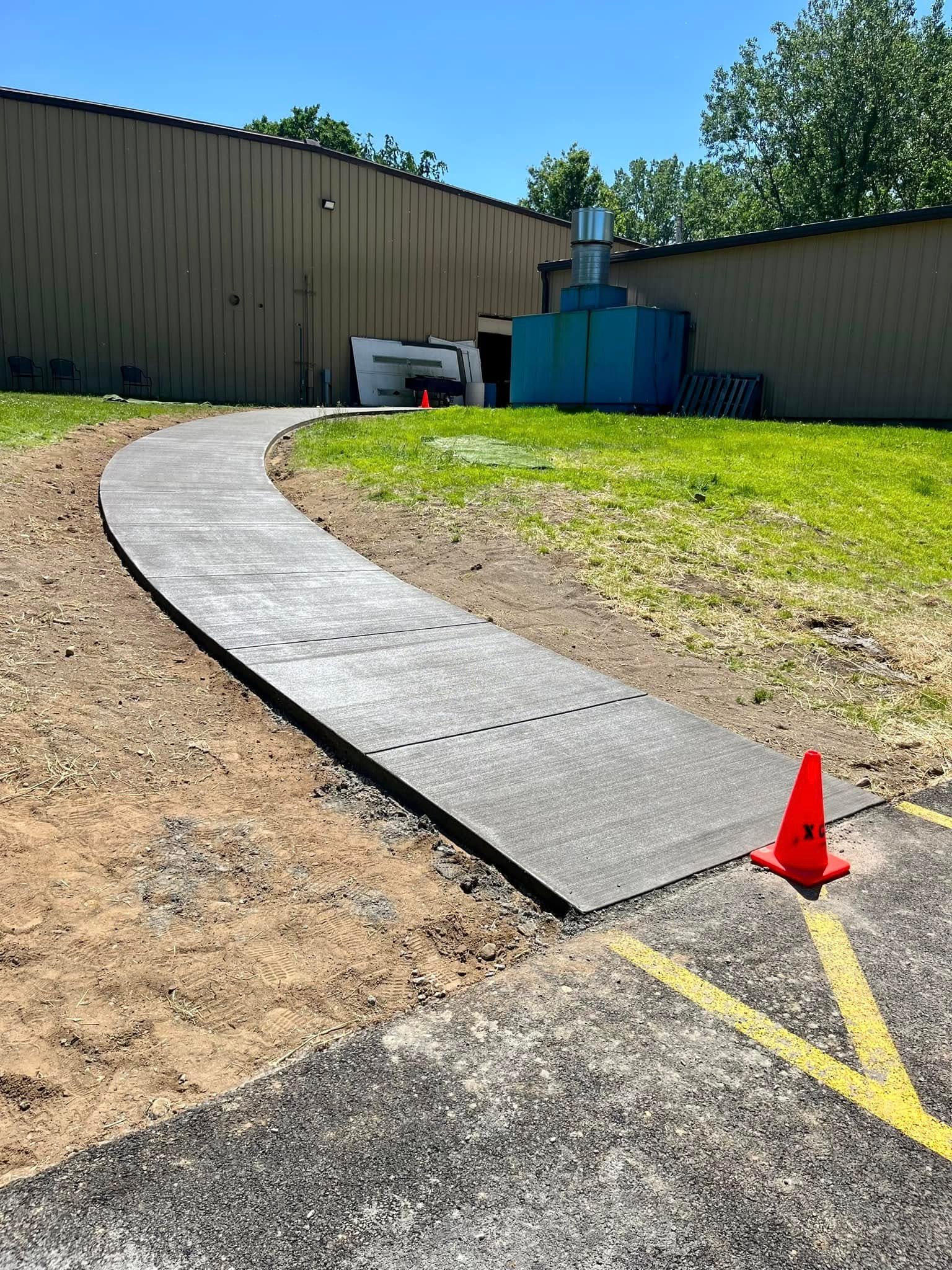 Xpress Construction & Services built a new, safe sidewalk for the community near a local industrial building.