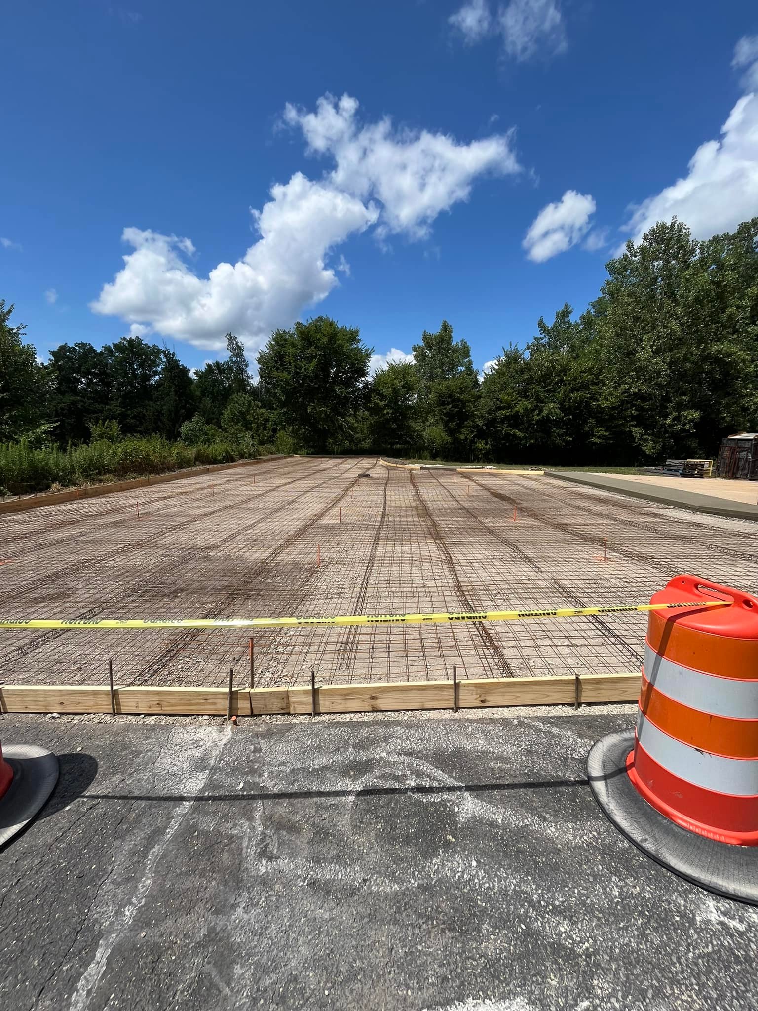 Xpress Construction & Services prepares a safe, secure concrete foundation work site with clear access controls in place.