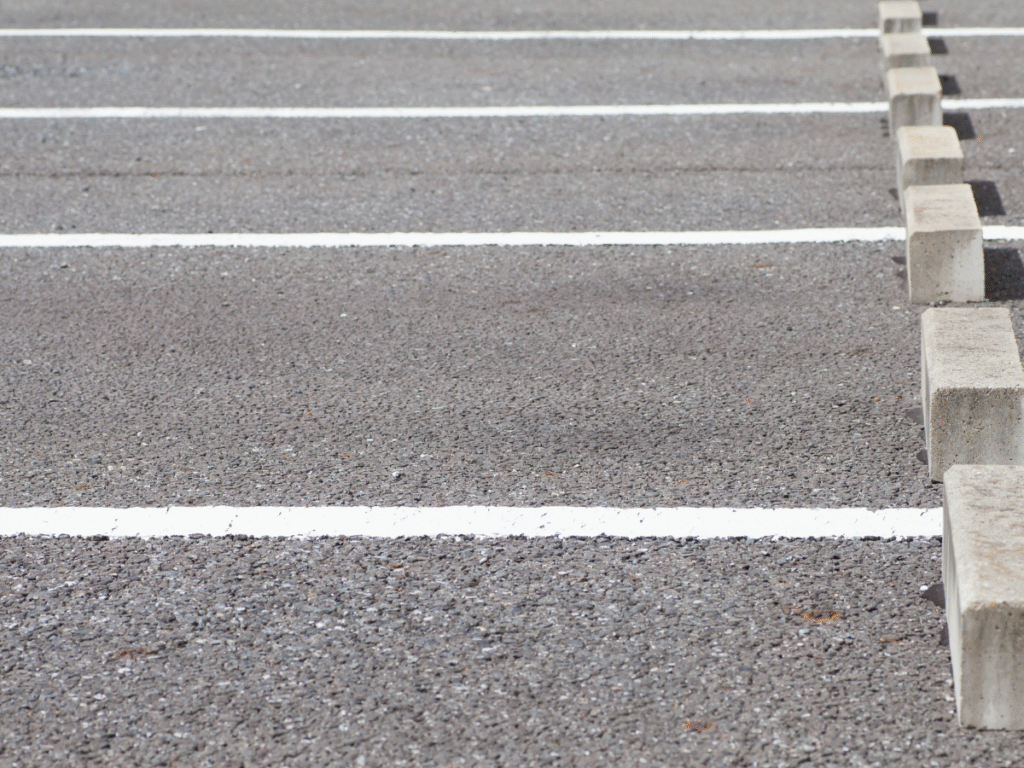 Xpress Construction & Services shows a neat, finished parking lot after careful concrete, excavation, and landscaping work.
