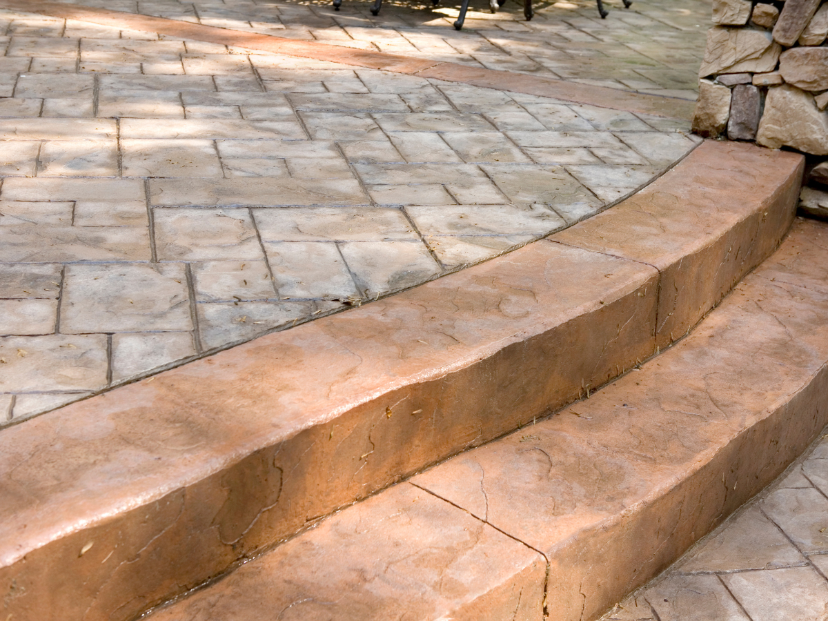 Xpress Construction & Services shows a strong, good-looking concrete patio and steps that will last and are easy to use.