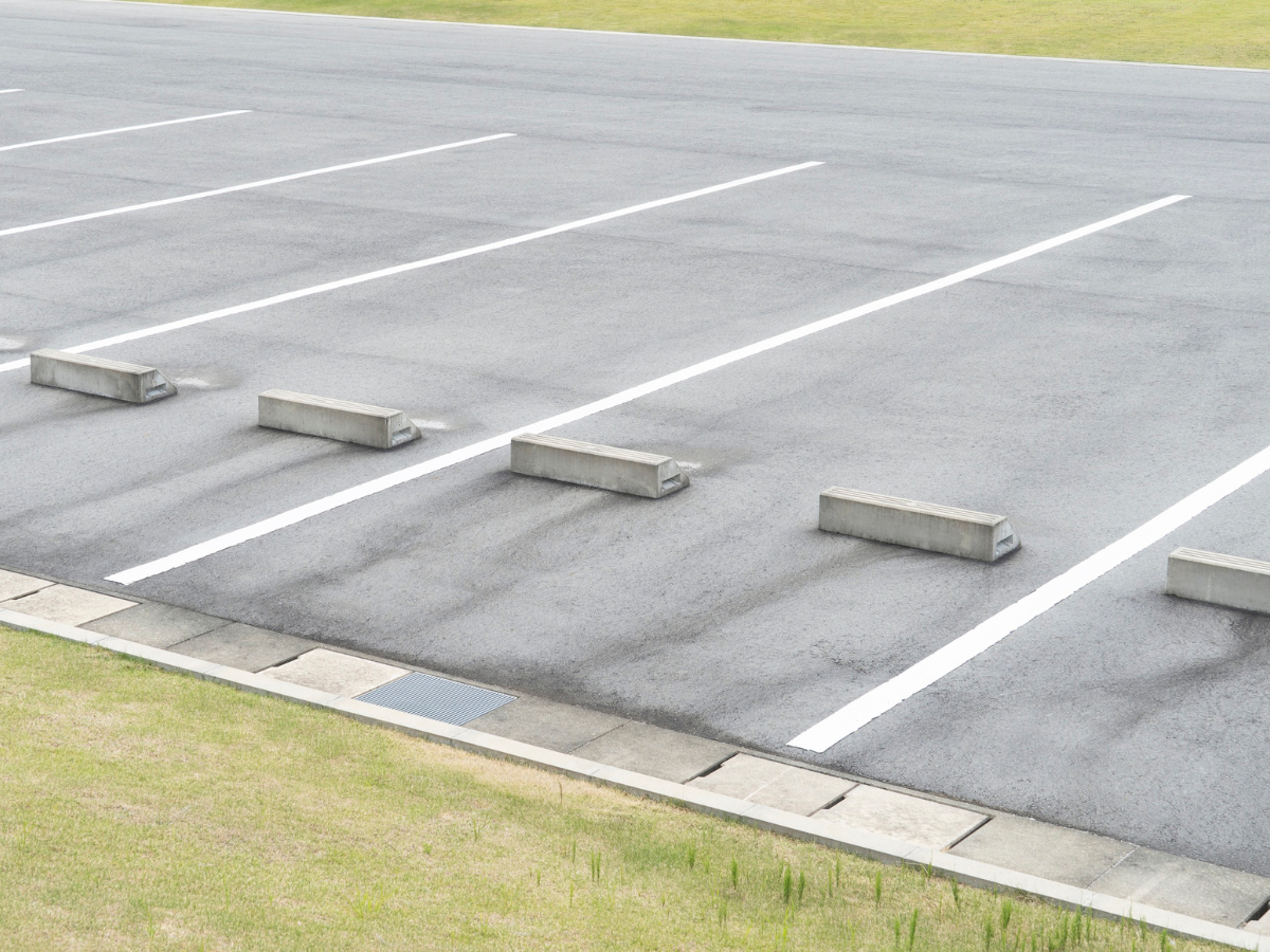 This image shows Xpress Construction & Services’ well-kept, ready-to-use parking lot with no cars present.